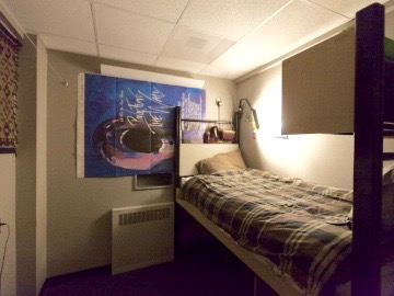 Private room in the station, with a bed, ligths, and posters on the wall. (Credit:Freija Descamps/NSF, 2011) 