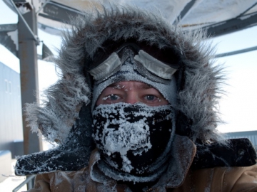 Portrait of E. Jacobi, clad in a winter anorak, goggles and facemask. (Credit: E . Jacobi)
